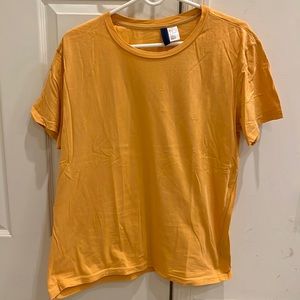 Divided Orange crew neck t-shirt. Size Medium